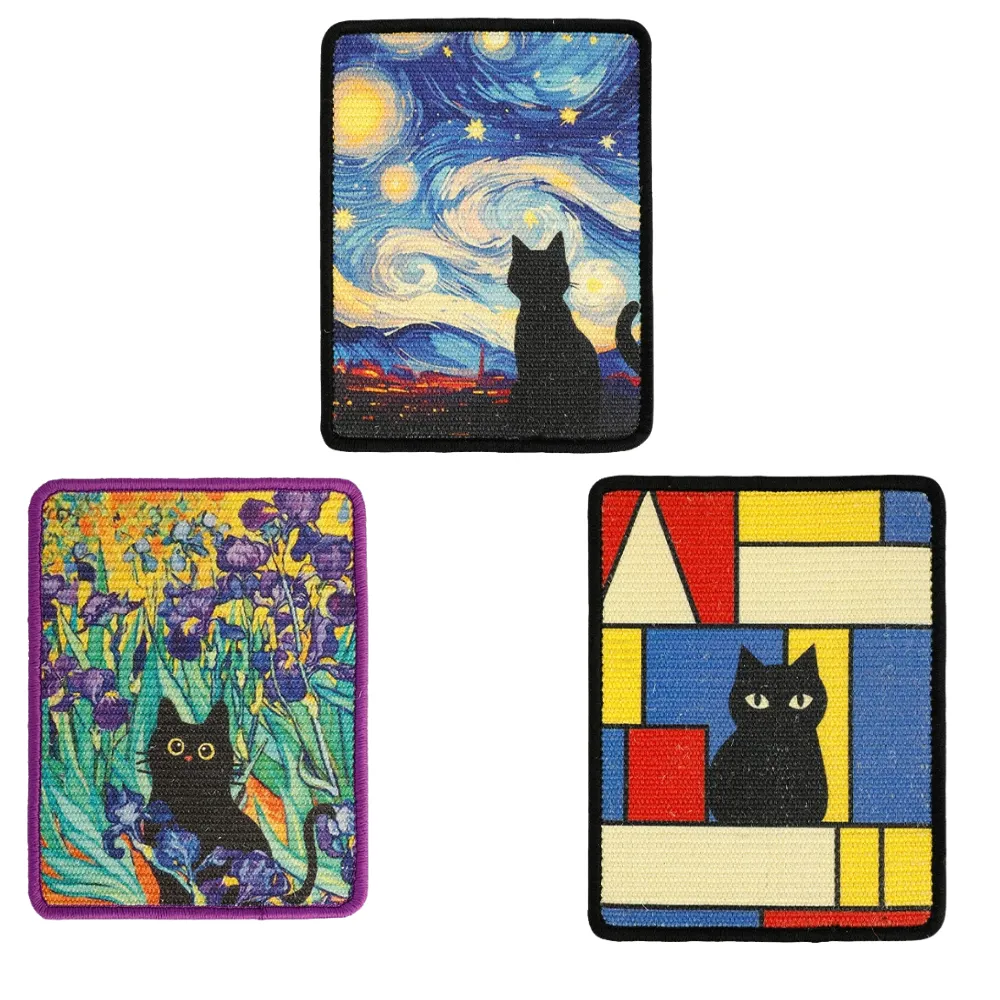 Three rectangular sisal cat scratch pads with blue, floral and geometric cat patterns