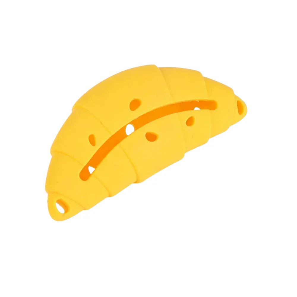 Easy-Fill Croissant Dog Treat Toy Yellow croissant dog treat toy with wide side opening for filling snacks and cleaning